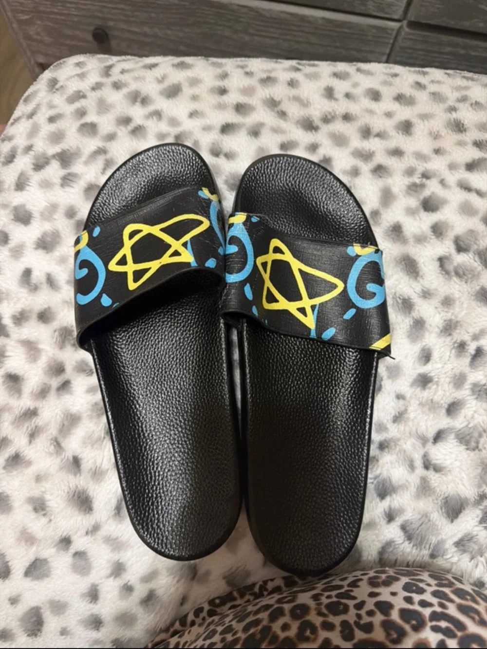 Gucci Black Slides with Yellow and Blue Graphic Strap